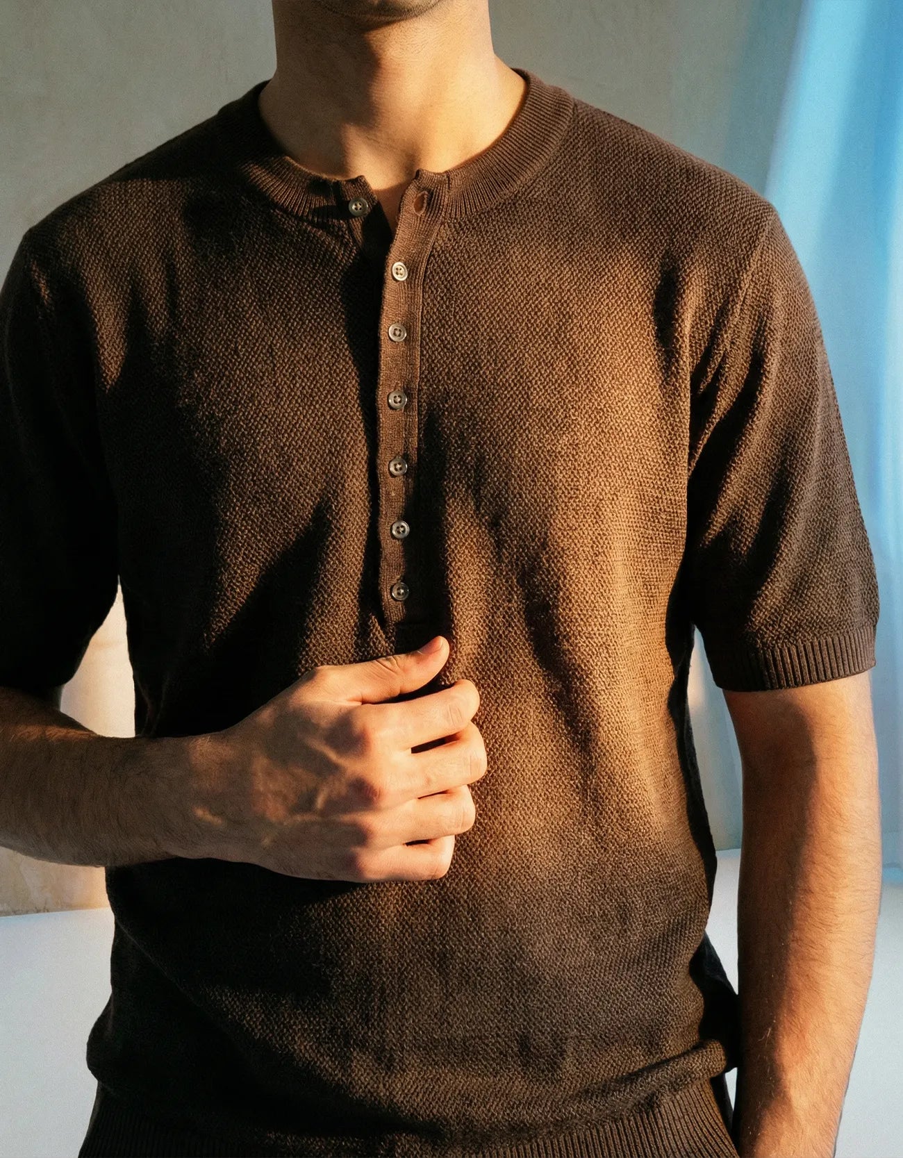 KNITTED QUARTER-BUTTON CREW NECK