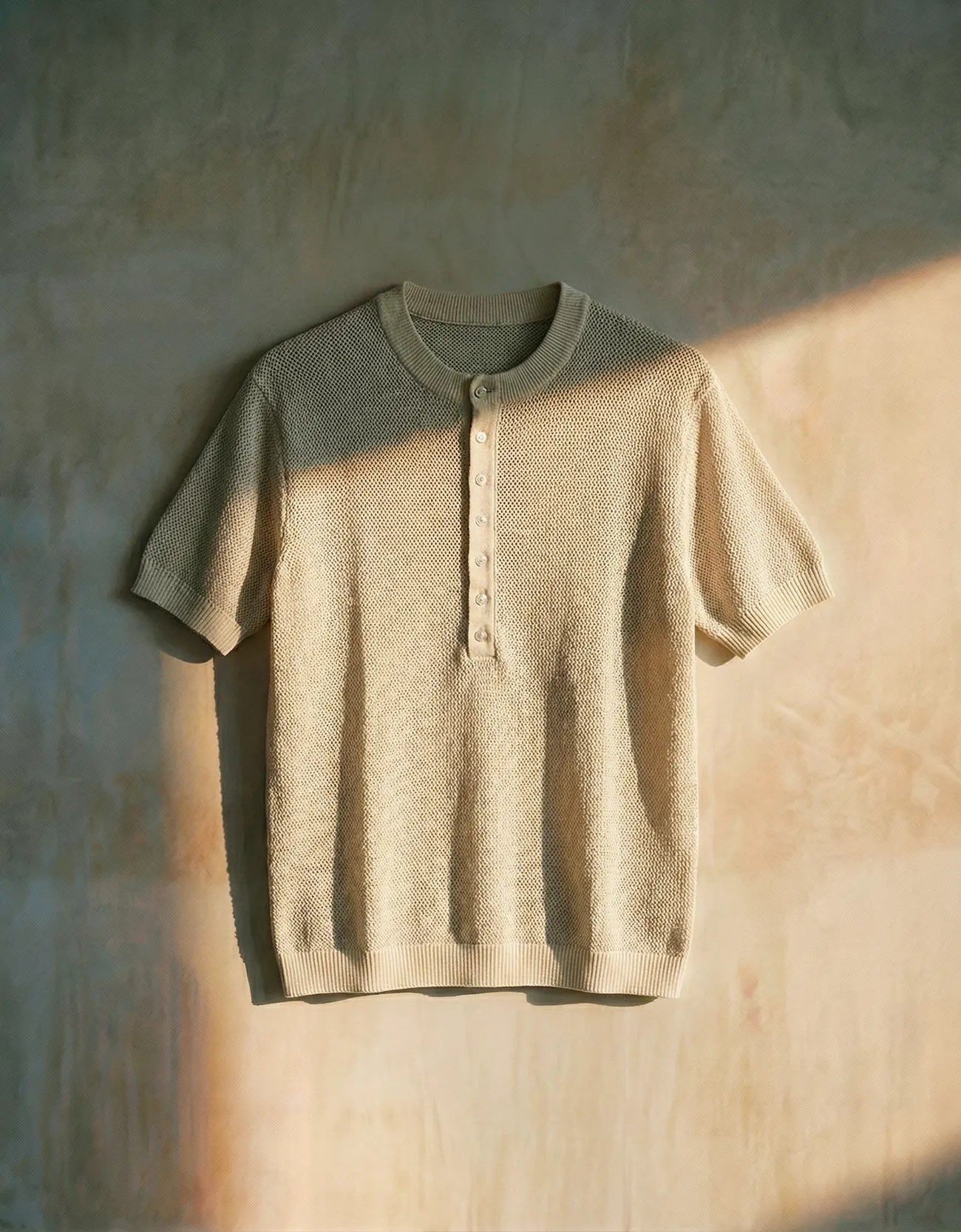 KNITTED QUARTER-BUTTON CREW NECK