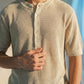 KNITTED QUARTER-BUTTON CREW NECK